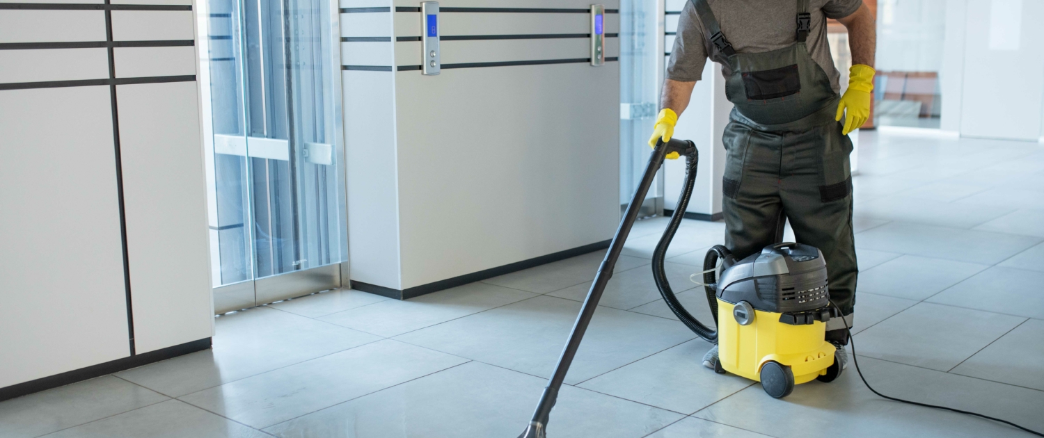 full-shot-man-vacuuming-office-floor